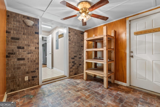 1206 Zittrouer Rd, Guyton, GA 31312 - foyer entrance with a ceiling fan, crown molding, baseboards, and wood walls