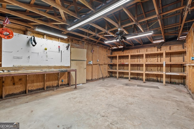 1206 Zittrouer Rd, Guyton, GA 31312 - garage featuring a workshop area and freestanding refrigerator