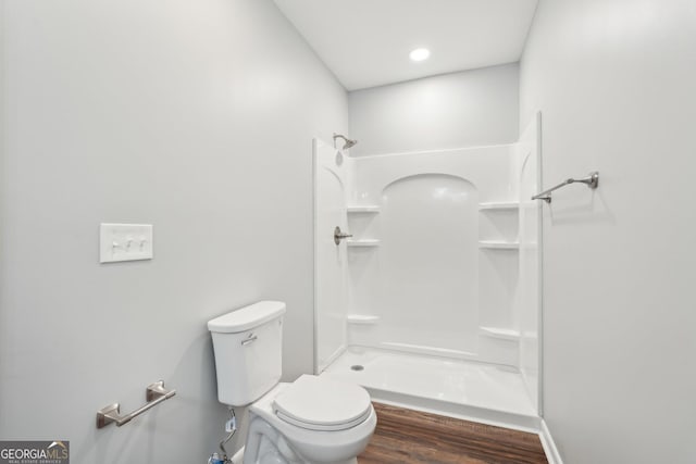 399 N Chestatee St, Dahlonega, GA 30533 - bathroom featuring a shower, toilet, and wood finished floors