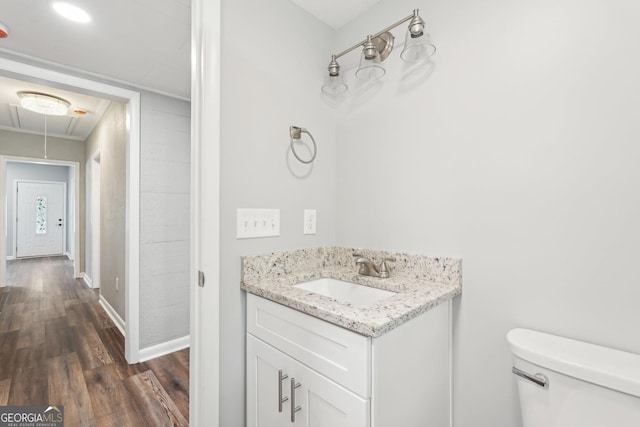 399 N Chestatee St, Dahlonega, GA 30533 - half bath with toilet, wood finished floors, vanity, and baseboards
