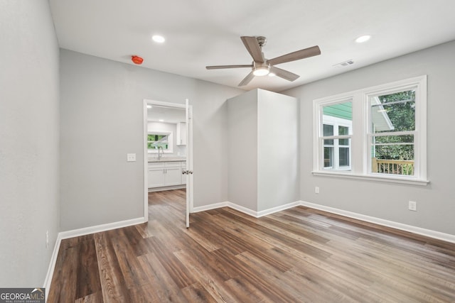 399 N Chestatee St, Dahlonega, GA 30533 - unfurnished room with wood finished floors, ceiling fan, baseboards, a sink, and recessed lighting