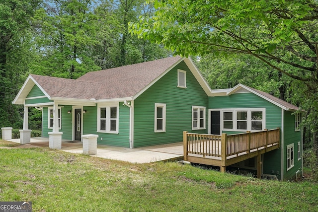 399 N Chestatee St, Dahlonega, GA 30533 - back of property with a lawn, a shingled roof, and a porch