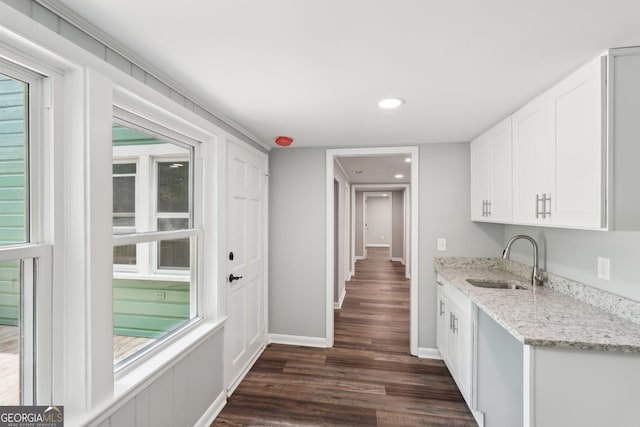 399 N Chestatee St, Dahlonega, GA 30533 - kitchen featuring a sink, dark wood-style floors, white cabinets, light stone counters, and baseboards