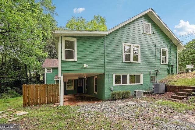 399 N Chestatee St, Dahlonega, GA 30533 - rear view of house featuring a carport and central AC