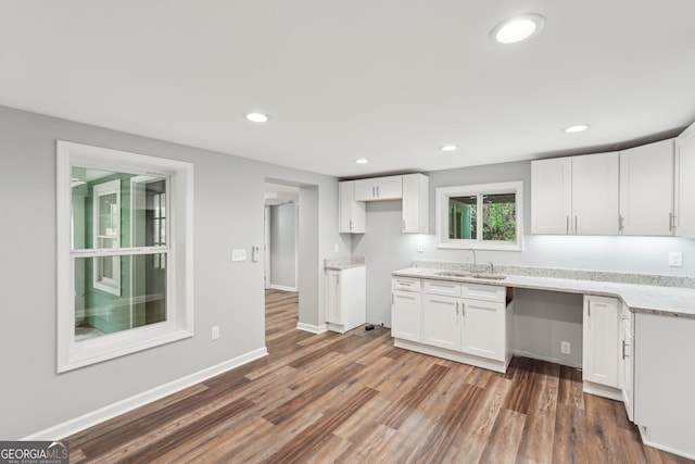 399 N Chestatee St, Dahlonega, GA 30533 - kitchen with a sink, dark wood-style flooring, white cabinets, recessed lighting, and light stone counters
