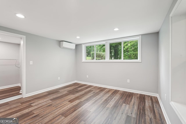 399 N Chestatee St, Dahlonega, GA 30533 - unfurnished room with a wall mounted air conditioner, wood finished floors, baseboards, and recessed lighting