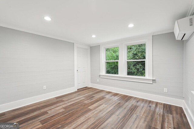 399 N Chestatee St, Dahlonega, GA 30533 - unfurnished room featuring baseboards, wood finished floors, a wall mounted AC, and recessed lighting