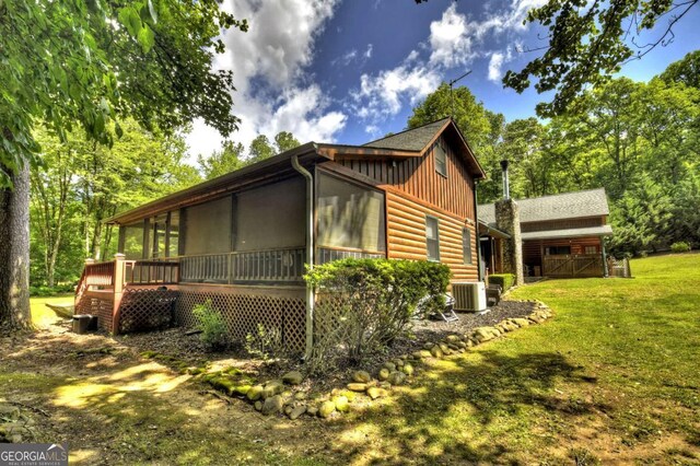 241 Dunn Mill Creek Rd, Blue Ridge, GA 30513 - view of home's exterior featuring a sunroom, board and batten siding, a yard, and faux log siding