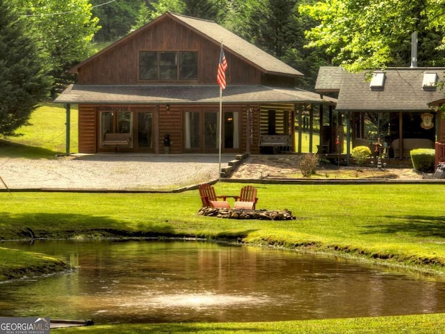 241 Dunn Mill Creek Rd, Blue Ridge, GA 30513 - rear view of house with a lawn, french doors, a shingled roof, and a water view