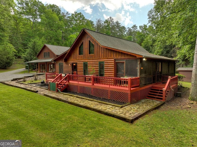 241 Dunn Mill Creek Rd, Blue Ridge, GA 30513 - back of property featuring log siding, a yard, a sunroom, board and batten siding, and a deck