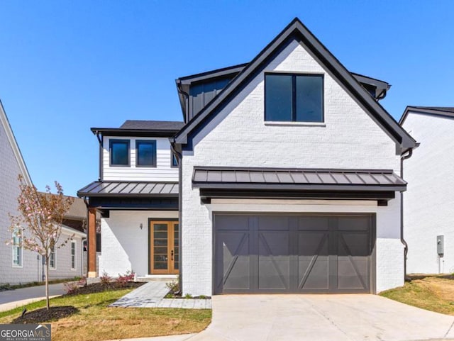 1240 Hayes Sq, Peachtree City, GA 30269 - view of front of home with a standing seam roof, brick siding, an attached garage, and concrete driveway
