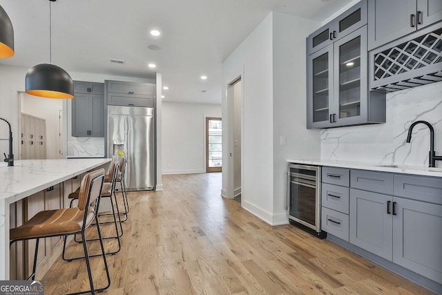1240 Hayes Sq, Peachtree City, GA 30269 - kitchen featuring high quality fridge, beverage cooler, gray cabinetry, a sink, and recessed lighting