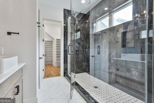 1240 Hayes Sq, Peachtree City, GA 30269 - bathroom with marble look tiles, a stall shower, and vanity