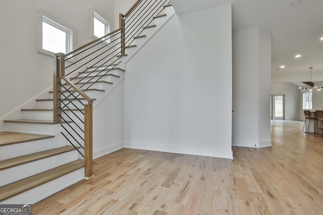1240 Hayes Sq, Peachtree City, GA 30269 - stairs with wood finished floors, recessed lighting, and baseboards