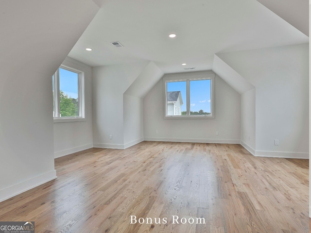 1240 Hayes Sq, Peachtree City, GA 30269 - additional living space with light wood-type flooring, vaulted ceiling, baseboards, and recessed lighting