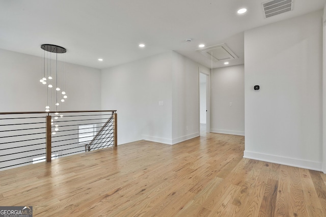 1240 Hayes Sq, Peachtree City, GA 30269 - unfurnished room with attic access, wood finished floors, recessed lighting, and baseboards