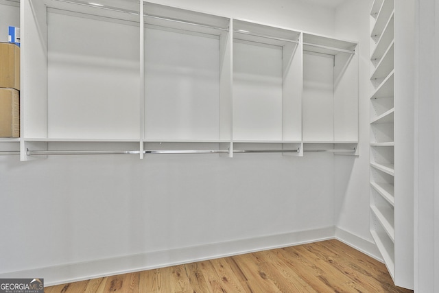 1240 Hayes Sq, Peachtree City, GA 30269 - walk in closet with wood finished floors
