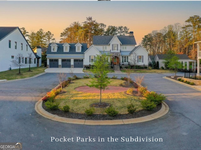 1240 Hayes Sq, Peachtree City, GA 30269 - view of front of property featuring a garage, curved driveway, and a chimney
