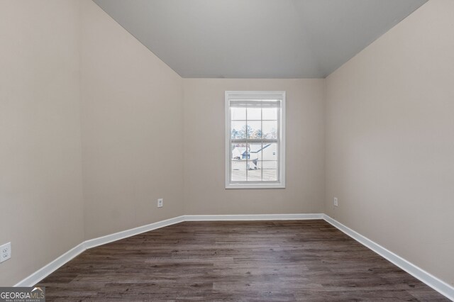 475 Louise Way, Locust Grove, GA 30248 - empty room featuring lofted ceiling, dark wood-style floors, and baseboards