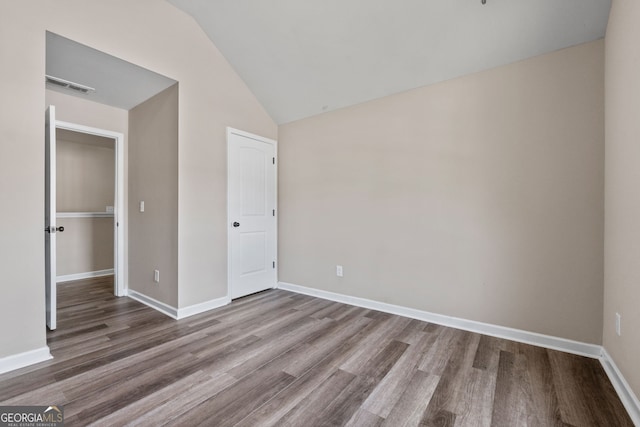 475 Louise Way, Locust Grove, GA 30248 - unfurnished bedroom featuring vaulted ceiling, wood finished floors, and baseboards