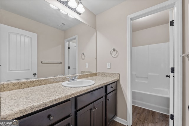 475 Louise Way, Locust Grove, GA 30248 - full bathroom featuring vanity, wood finished floors, tub / shower combination, and baseboards