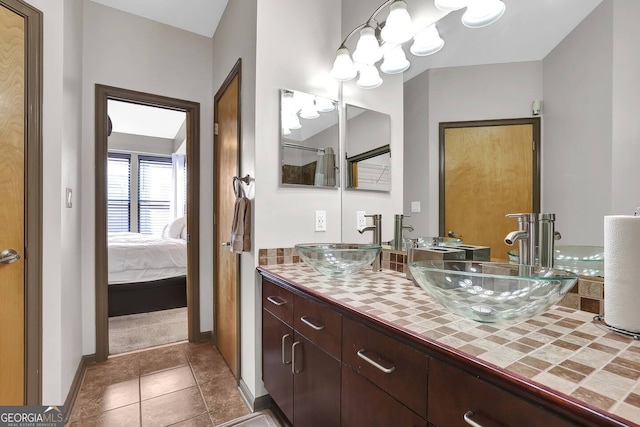 898 Oak St SW Unit 3204, Atlanta, GA 30310 - ensuite bathroom with double vanity, baseboards, and tile patterned flooring