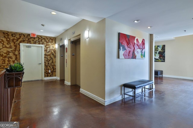 898 Oak St SW Unit 3204, Atlanta, GA 30310 - hallway with baseboards, concrete flooring, elevator, recessed lighting, and wallpapered walls