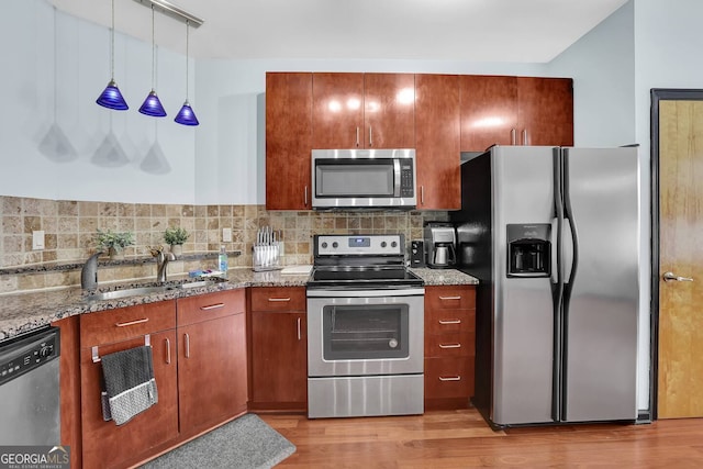 898 Oak St SW Unit 3204, Atlanta, GA 30310 - kitchen featuring stainless steel appliances, tasteful backsplash, light wood-style flooring, and light stone countertops