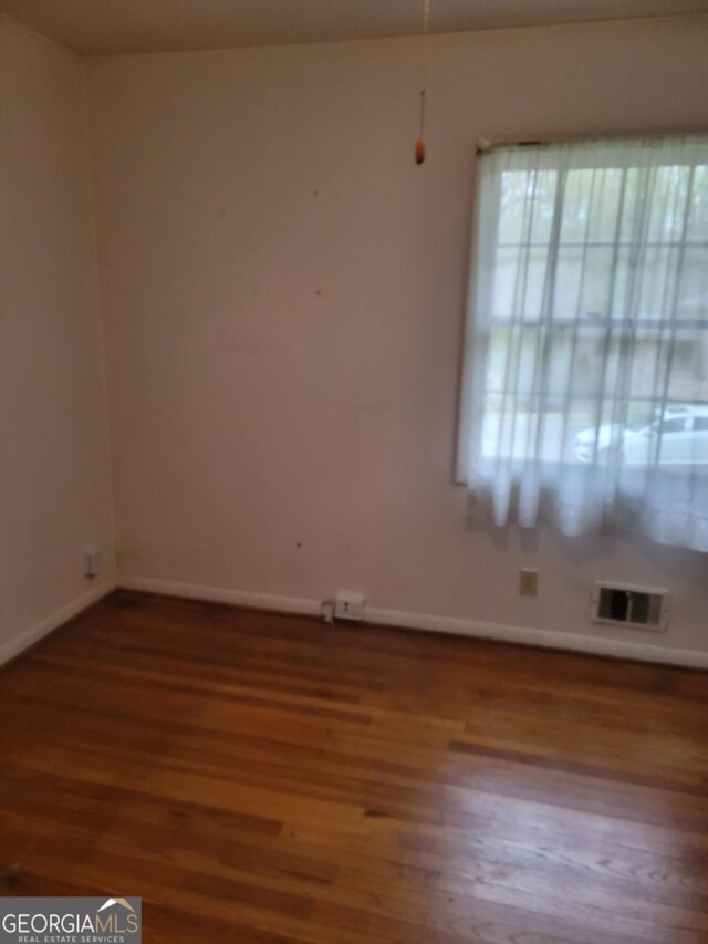 2137 Plantation Ln, Chamblee, GA 30341 - empty room with wood finished floors and baseboards