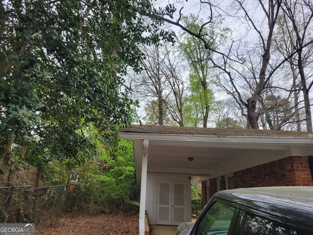 2137 Plantation Ln, Chamblee, GA 30341 - view of vehicle parking featuring a carport