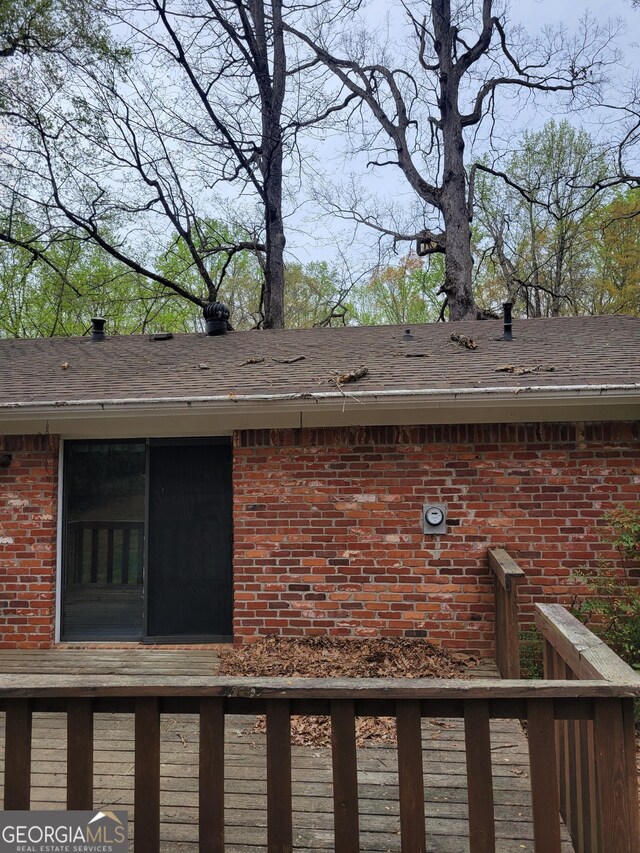 2137 Plantation Ln, Chamblee, GA 30341 - exterior view of brick siding, a shingled roof, and gutters