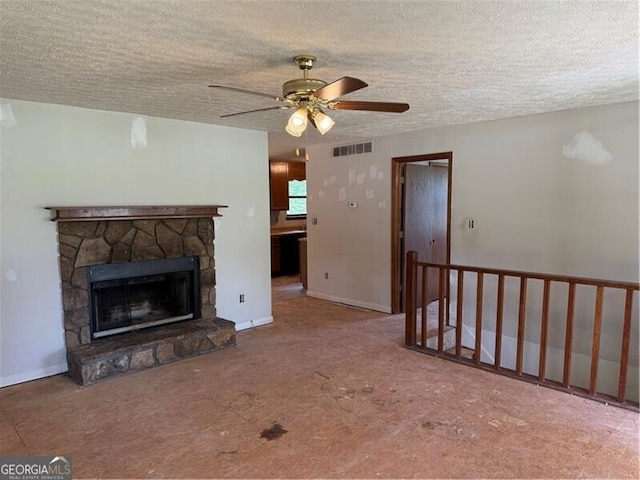 285 Woodland St, Dallas, GA 30157 - unfurnished living room with a textured ceiling, ceiling fan, a fireplace, and carpet floors