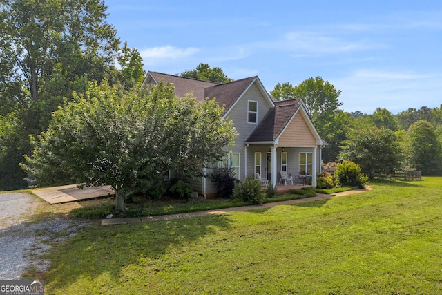 152 Charity Dr, Homer, GA 30547 - view of front facade with a porch, a front lawn, and a shingled roof