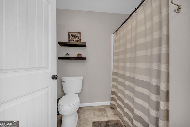152 Charity Dr, Homer, GA 30547 - bathroom featuring toilet, baseboards, and a shower with curtain