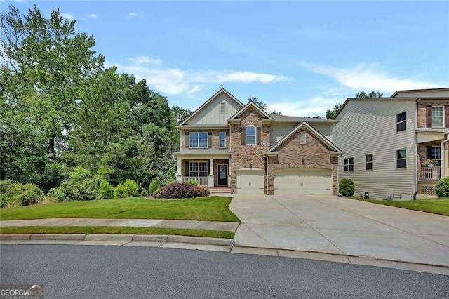 204 Starwood Ct, Acworth, GA 30102 - craftsman inspired home featuring stone siding, concrete driveway, a front yard, and a garage
