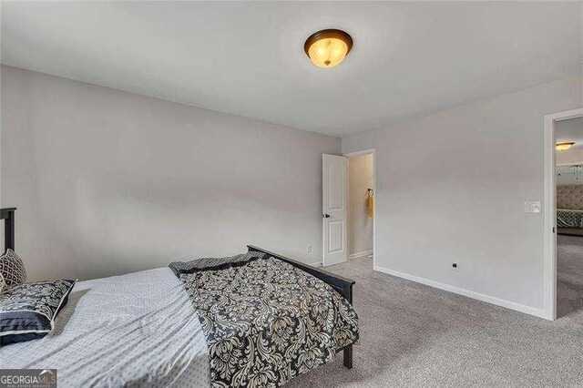 204 Starwood Ct, Acworth, GA 30102 - carpeted bedroom featuring baseboards