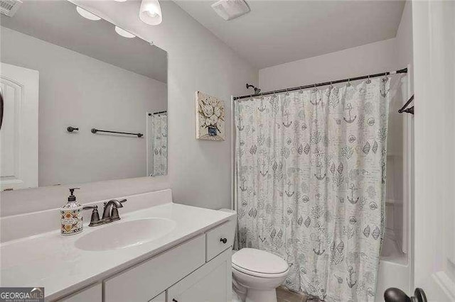 204 Starwood Ct, Acworth, GA 30102 - bathroom featuring vanity, toilet, and shower / bath combination with curtain