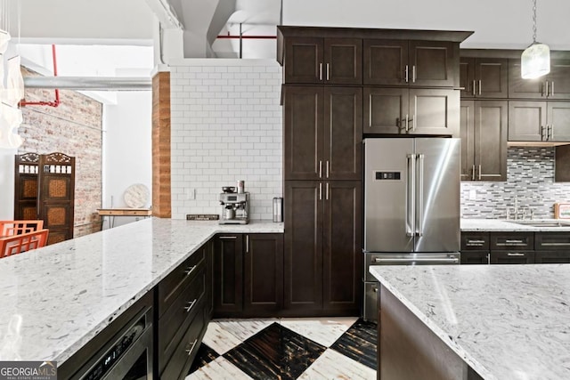 87 Peachtree St SW Unit 209, Atlanta, GA 30303 - kitchen with high end fridge, decorative backsplash, light stone counters, and dark brown cabinetry