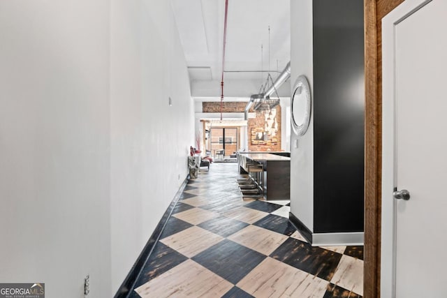 87 Peachtree St SW Unit 209, Atlanta, GA 30303 - hallway with a high ceiling and baseboards