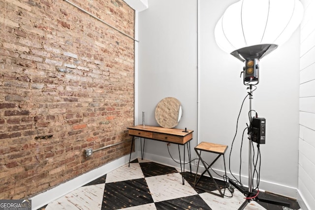 87 Peachtree St SW Unit 209, Atlanta, GA 30303 - misc room with brick wall and baseboards