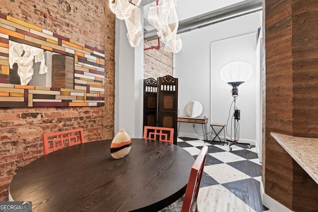 87 Peachtree St SW Unit 209, Atlanta, GA 30303 - dining space with tile patterned floors and wooden walls