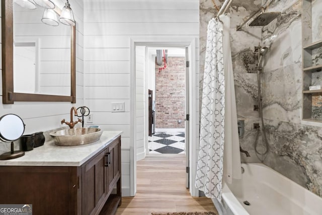 87 Peachtree St SW Unit 209, Atlanta, GA 30303 - full bathroom with vanity, shower / bath combo with shower curtain, and wood finished floors