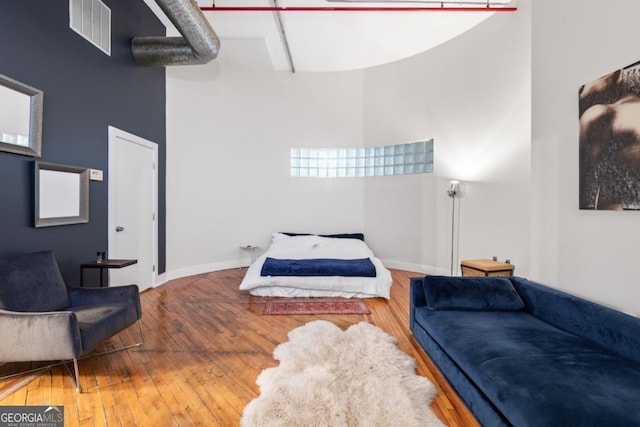 87 Peachtree St SW Unit 209, Atlanta, GA 30303 - bedroom featuring hardwood / wood-style floors and baseboards