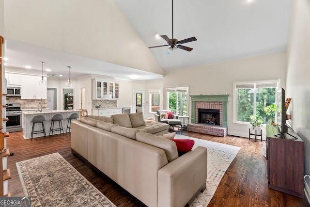 635 Piping Rock Pt, Lawrenceville, GA 30043 - living room with high vaulted ceiling, ceiling fan, a fireplace, recessed lighting, and dark wood-style flooring