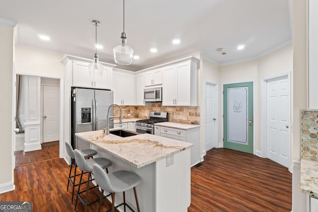 635 Piping Rock Pt, Lawrenceville, GA 30043 - kitchen featuring stainless steel appliances, a sink, dark wood-type flooring, white cabinetry, and light stone counters