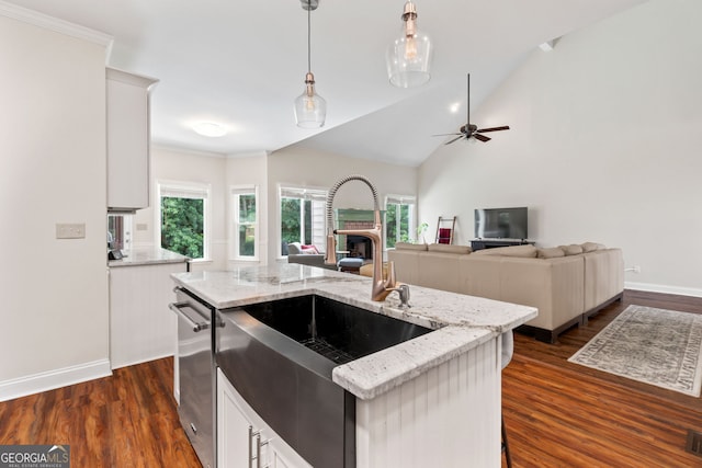 635 Piping Rock Pt, Lawrenceville, GA 30043 - kitchen featuring stainless steel dishwasher, a sink, pendant lighting, healthy amount of natural light, and ornamental molding