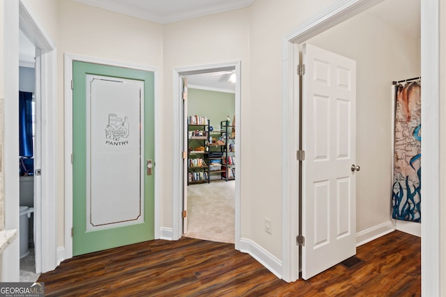 635 Piping Rock Pt, Lawrenceville, GA 30043 - entrance foyer with dark wood finished floors, ornamental molding, and baseboards