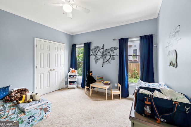 635 Piping Rock Pt, Lawrenceville, GA 30043 - carpeted bedroom featuring a closet, ornamental molding, and a ceiling fan