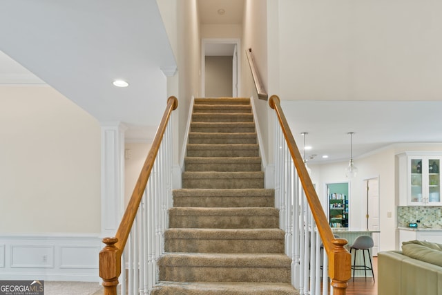635 Piping Rock Pt, Lawrenceville, GA 30043 - stairway featuring recessed lighting and crown molding