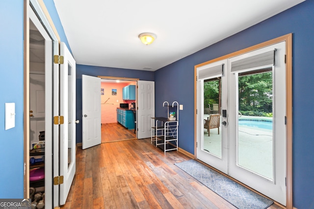 635 Piping Rock Pt, Lawrenceville, GA 30043 - doorway featuring french doors, wood-type flooring, and baseboards